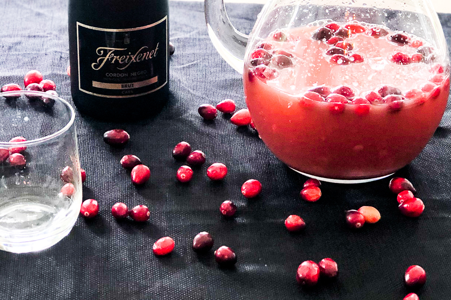 Sparkling Cranberry Orange Punch on a table with champagne