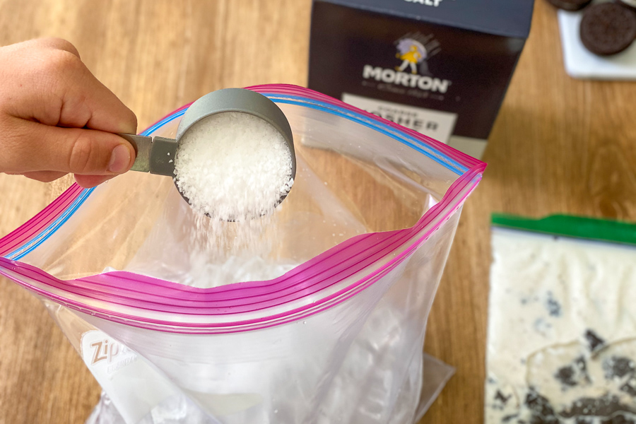 Pouring salt into bag of ice