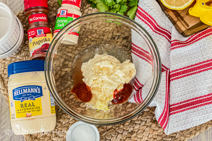 All the ingredients for the Simple Sriracha Aioli Recipe in a bowl before being mixed. 